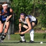 ladies playing field hockey