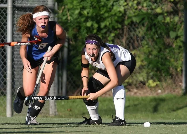 ladies playing field hockey