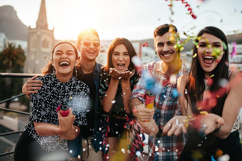 Friends with white teeth at party