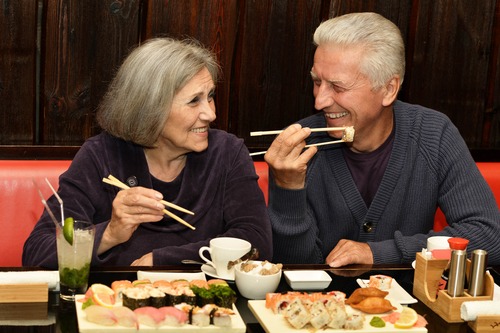 older couple eating sushi